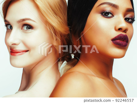 different nation woman: african-american and caucasian together isolated on white background happy smiling, diverse type on skin, lifestyle people concept close up different nation woman: african-american and caucasian together isolated on white background happy smiling, diverse type on skin, lifestyle people concept close up 92246557