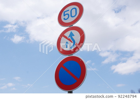 Road sign, maximum speed, parking prohibited, right side part for overtaking is prohibited Road sign, maximum speed, parking prohibited, right side part for overtaking is prohibited 92248794