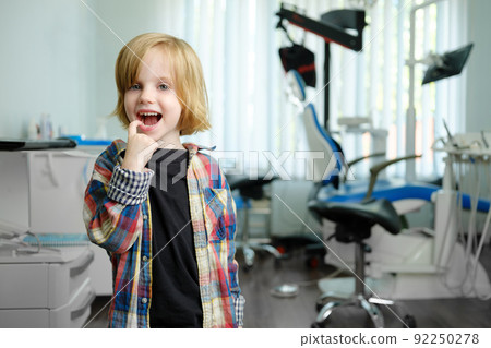 Portrait of cute boy in dental cabinet 92250278