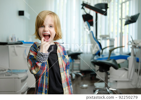 Portrait of cute boy in dental cabinet Portrait of cute boy in dental cabinet 92250279