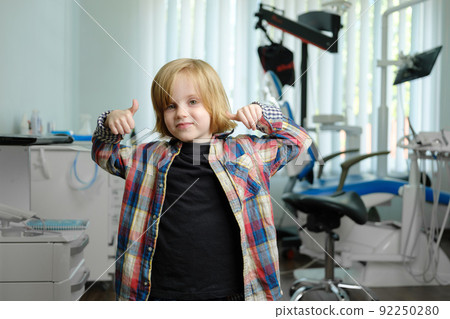 Portrait of cute boy in dental cabinet Portrait of cute boy in dental cabinet 92250280