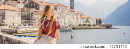 BANNER, LONG FORMAT Woman tourist enjoying Colorful street in Old town of Perast on a sunny day, Montenegro. Travel to Montenegro concept. Scenic panorama view of the historic town of Perast at famous BANNER, LONG FORMAT Woman tourist enjoying Colorful street in Old town of Perast on a sunny day, Montenegro. Travel to Montenegro concept. Scenic panorama view of the historic town of Perast at famous 92251753