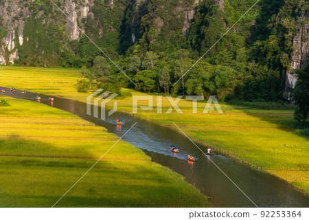 Yellow rice field on Ngo Dong river in Tam Coc Bich Dong from mountain top view in Ninh Binh, Viet Nam 92253364