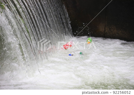 PET bottle garbage gathering near the river dam 92256052