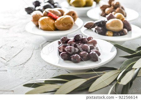 set of selected pickled olives in white bowls set of selected pickled olives in white bowls 92256614