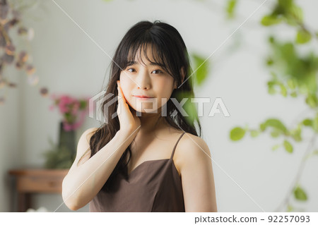 Woman in brown camisole 92257093