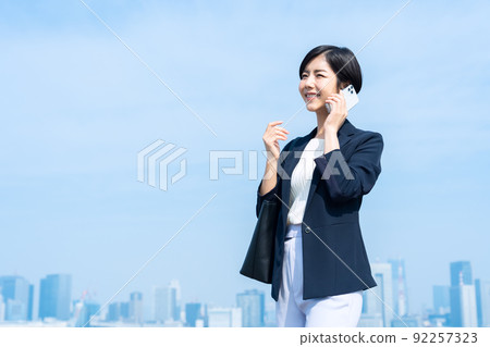 Female business commuting office smartphone business woman Female business commuting office smartphone business woman 92257323