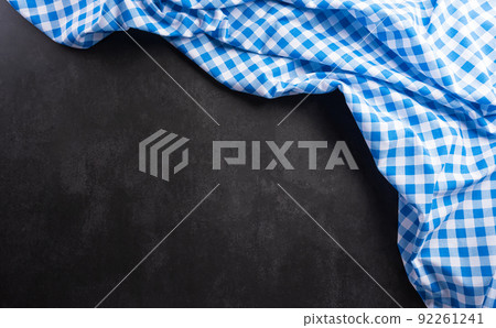 Oktoberfest festival decoration symbols made from  Bavarian white and blue fabric on dark stone background. 92261241