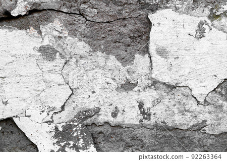 Stone wall with deep cracks. Break in the ground. Drought and consequences. Stone wall with deep cracks. Break in the ground. Drought and consequences. 92263364