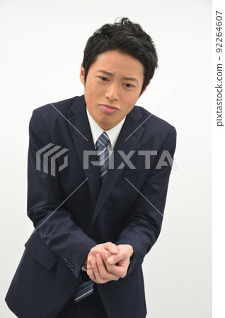 Young man rubbing hands 92264607