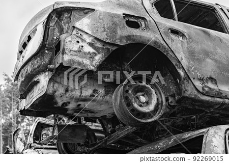 Dump of war-destroyed cars in Ukraine, black and white photo 92269015