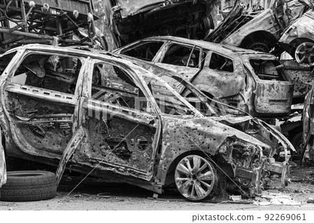 Shot and burned cars during the war in Ukraine, black and white photo Shot and burned cars during the war in Ukraine, black and white photo 92269061