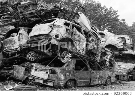 Black and white photo of the war in Ukraine - destroyed cars in Bucha district 92269063