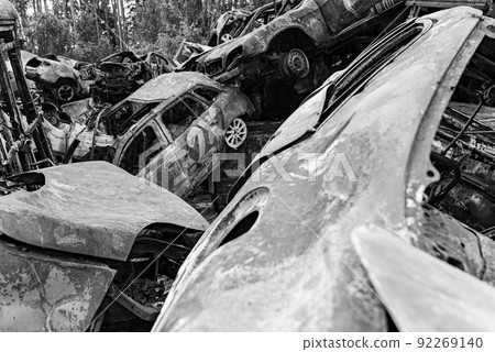 Shot and burned cars during the war in Ukraine, black and white photo Shot and burned cars during the war in Ukraine, black and white photo 92269140