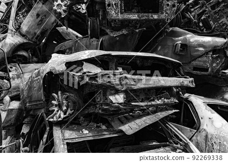 Black and white photo of the war in Ukraine - destroyed cars in Bucha district 92269338