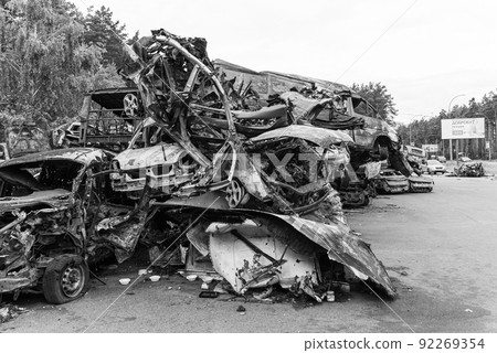 Shot and burned cars during the war in Ukraine, black and white photo Shot and burned cars during the war in Ukraine, black and white photo 92269354