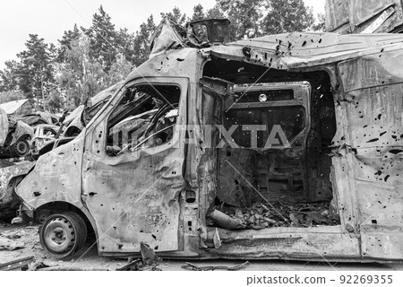 Dump of war-destroyed cars in Ukraine, black and white photo 92269355