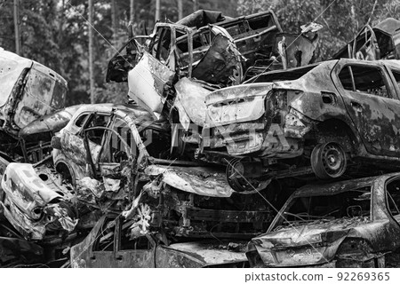 Black and white photo of the war in Ukraine - destroyed cars in Bucha district 92269365
