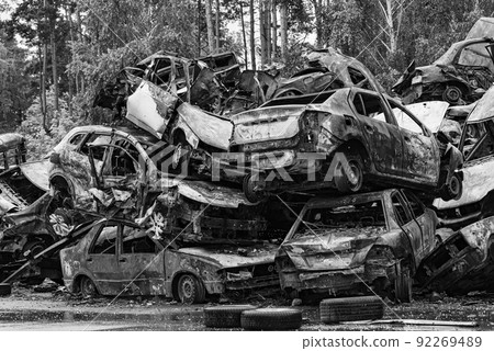 Black and white photo of the war in Ukraine - destroyed cars in Bucha district Black and white photo of the war in Ukraine - destroyed cars in Bucha district 92269489