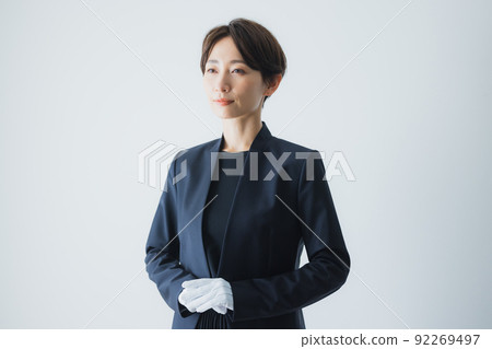 Female staff wearing white gloves 92269497
