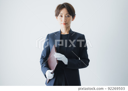 Female staff wearing white gloves 92269503