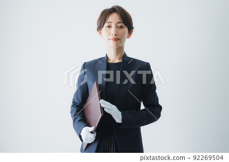 Female staff wearing white gloves 92269504