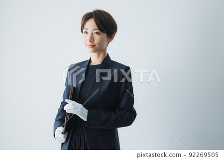 Female staff wearing white gloves 92269505