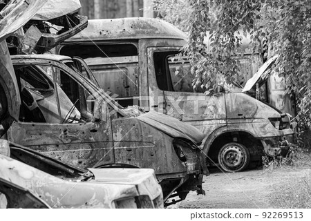 Black and white photo of the war in Ukraine - destroyed cars in Bucha district 92269513