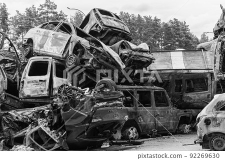 Shot and burned cars during the war in Ukraine, black and white photo Shot and burned cars during the war in Ukraine, black and white photo 92269630