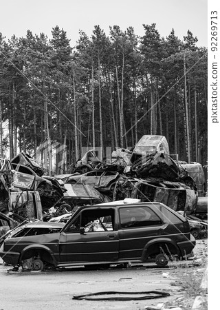 Shot and burned cars during the war in Ukraine, black and white photo Shot and burned cars during the war in Ukraine, black and white photo 92269713