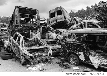 Dump of war-destroyed cars in Ukraine, black and white photo 92269731