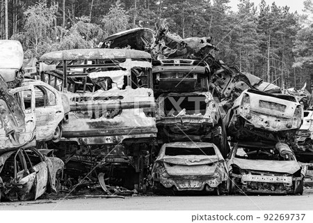 Black and white photo of the war in Ukraine - destroyed cars in Bucha district 92269737