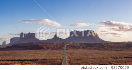 Scenic Road in the Dry Desert with Red Rocky Mountains in Background. Scenic Road in the Dry Desert with Red Rocky Mountains in Background. 92270099