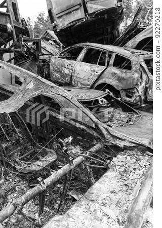 Black and white photo of the war in Ukraine - destroyed cars in Bucha district Black and white photo of the war in Ukraine - destroyed cars in Bucha district 92270218
