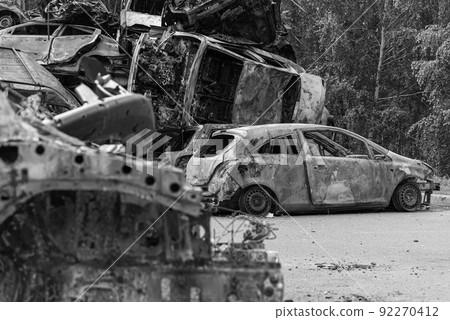 Dump of war-destroyed cars in Ukraine, black and white photo Dump of war-destroyed cars in Ukraine, black and white photo 92270412