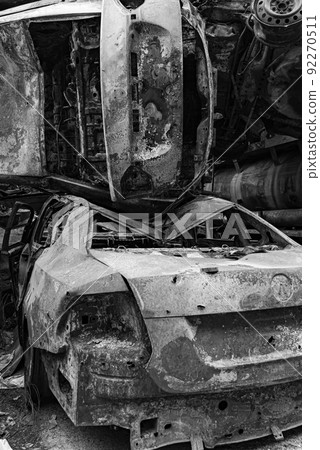 Black and white photo of the war in Ukraine - destroyed cars in Bucha district Black and white photo of the war in Ukraine - destroyed cars in Bucha district 92270511