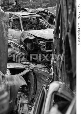 Shot and burned cars during the war in Ukraine, black and white photo Shot and burned cars during the war in Ukraine, black and white photo 92270839