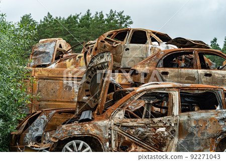 Shot and burned cars during the war in Ukraine Shot and burned cars during the war in Ukraine 92271043