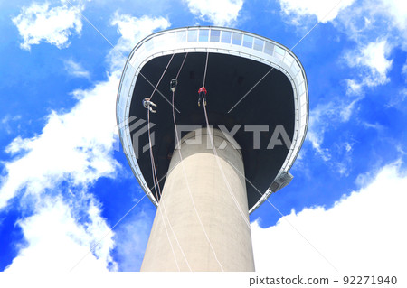 Three young People abseiling down the Eromast tower in Rotterdam Three young People abseiling down the Eromast tower in Rotterdam 92271940