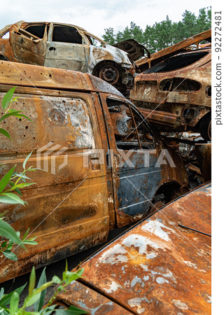 Consequences of the war in Ukraine - destroyed cars in Irpin, Bucha district. 92272481