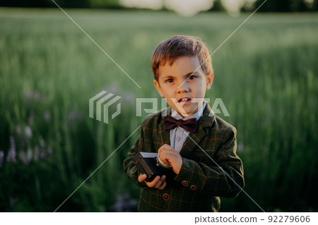 Handsome little boy with vintage retro camera. Kid as young photographer studying to take pictures 92279606