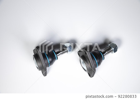 two New ball joint with rubber black boot on gray gradient background two New ball joint with rubber black boot on gray gradient background 92280833