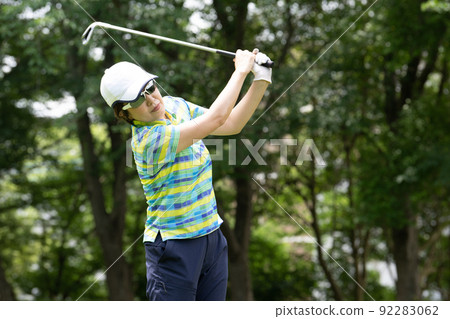 Women playing golf Women playing golf 92283062