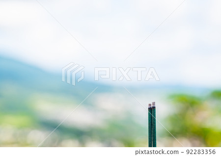 Two burning incense sticks Two burning incense sticks 92283356