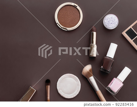 Beauty, make-up and cosmetics flatlay design with copyspace, cosmetic products and makeup tools on brown background, girly and feminine style concept 92283416