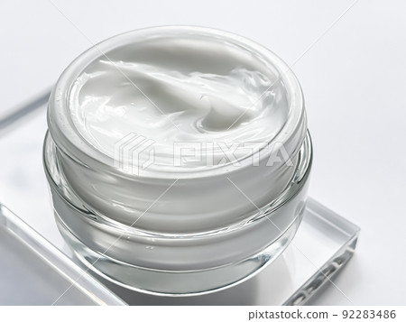 Face cream moisturiser jar and product sample on glass, beauty and skincare, cosmetic science concept Face cream moisturiser jar and product sample on glass, beauty and skincare, cosmetic science concept 92283486