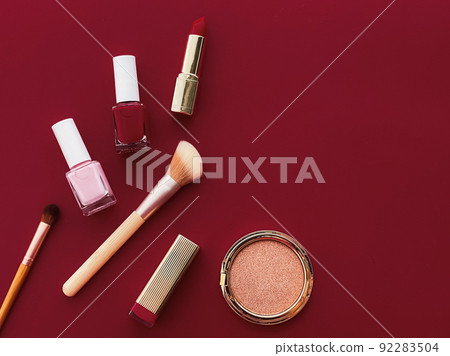 Beauty, make-up and cosmetics flatlay design with copyspace, cosmetic products and makeup tools on burgundy background, girly and feminine style concept 92283504