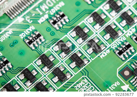 Close-up of a green computer printed circuit board with chips Close-up of a green computer printed circuit board with chips 92283677