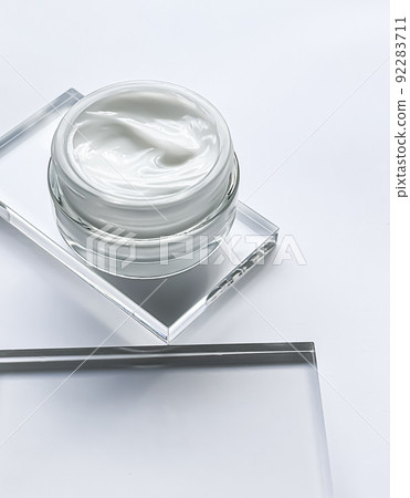 Face cream moisturiser jar and product sample on glass, beauty and skincare, cosmetic science concept 92283711