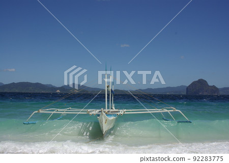 A view of the El Nido area of Palawan Island, Philippines. A sea area with towering marble rocks. A view of the El Nido area of Palawan Island, Philippines. A sea area with towering marble rocks. 92283775